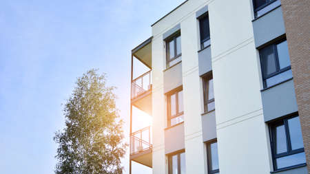 Architectural details of modern apartment building. Modern european residential apartment building complex. Sunset.の写真素材