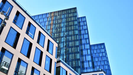 Glass curtain wall of modern office building. Modern office building on a clear sky background.