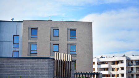 Futuristic square architecture of apartment building for real estate with big windows. Modern...