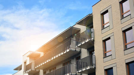 Apartment residential house and home facade architecture and outdoor facilities. Blue sky on the...