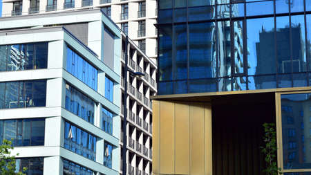 Fragment facade of a modern office building with glazing, perspective.