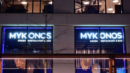 Warsaw, Poland. 24 November 2020. Sign Mykonos. Company signboard Mykonos.