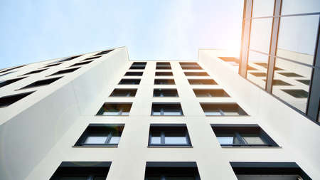Modern apartment buildings on a sunny day with a blue sky. Facade of a modern apartment building....