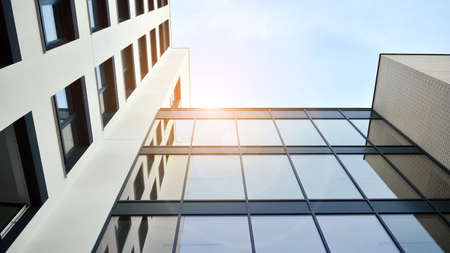 Modern apartment buildings on a sunny day with a blue sky. Facade of a modern apartment building....