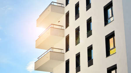 Modern apartment buildings on a sunny day with a blue sky. Facade of a modern apartment building....