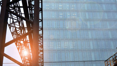 Bottom view of modern office buildings in the business district. Skyscraper glass facades on a...