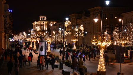 Warsaw, Poland. 25 December 2020. Night view of historic street in Christmas decoration at winter night.のeditorial素材