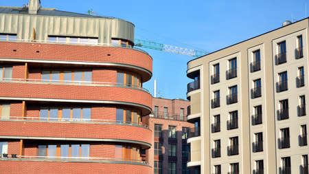 View of architectural exterior detail of residential apartment building with brick facade. Modern...