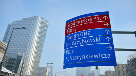 Warsaw, Poland. 18 January 2021. Blue signpost streets with directions.のeditorial素材