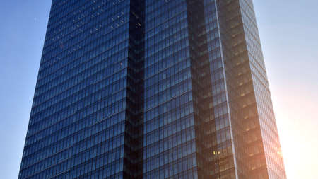 Concept for real estate and corporate construction..The modern office building of the orange morning...