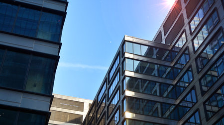 Concept for real estate and corporate construction..The modern office building of the orange morning...
