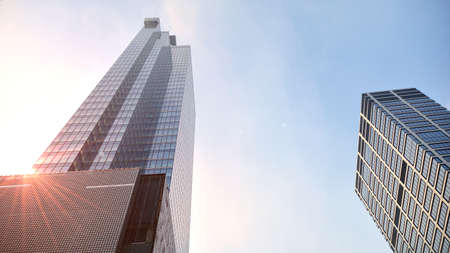 Concept for real estate and corporate construction..The modern office building of the orange morning...