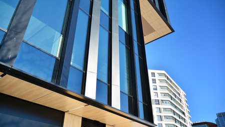 A residential building and an adjacent office building. Modern urban development.