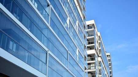 Condominium and apartment building with symmetrical modern architecture in the city downtown.