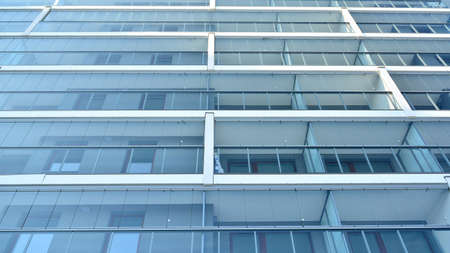 Condominium and apartment building with symmetrical modern architecture in the city downtown.