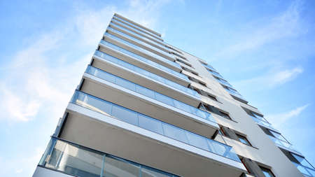 Condominium and apartment building with symmetrical modern architecture in the city downtown.