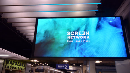 Warsaw, Poland. 22 February 2021. The large LED billboard. Advertising billboard in the train station.のeditorial素材