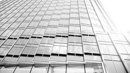 Downtown corporate business district architecture. Glass reflective office buildings against sky....