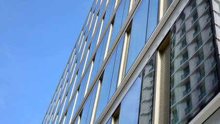 Fragment of glass and metal facade walls. Commercial office buildings. Abstract modern business...