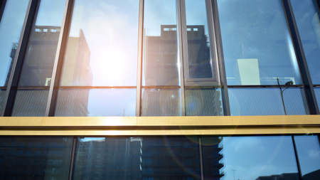 Fragment of glass and metal facade walls. Commercial office buildings. Abstract modern business architecture.の写真素材