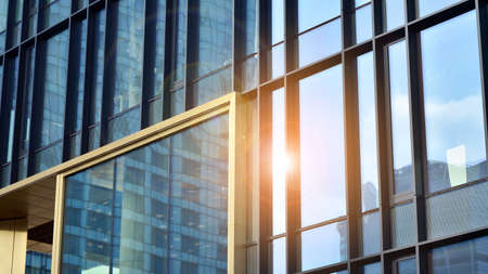 Fragment of glass and metal facade walls. Commercial office buildings. Abstract modern business...