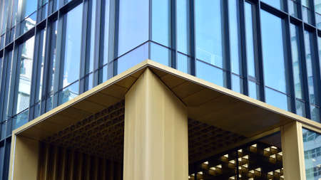 Fragment of glass and metal facade walls. Commercial office buildings. Abstract modern business...