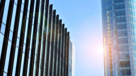 Fragment of glass and metal facade walls. Commercial office buildings. Abstract modern business architecture.の写真素材
