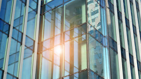 Fragment of glass and metal facade walls. Commercial office buildings. Abstract modern business...