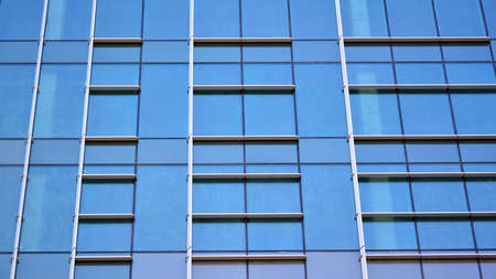 Fragment of glass and metal facade walls. Commercial office buildings. Abstract modern business...