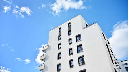Multistoried modern, new and stylish living block of flats. Newly built apartment building.