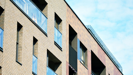 Architectural details of modern apartment building. Modern european residential apartment building...