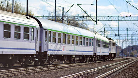 Warsaw, Poland. 26 April 2021. Passenger train of public transport on railroad track.