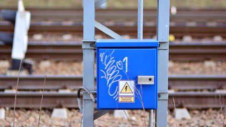 Electric iron box, switches, detail on the railway tracks at the railway station.