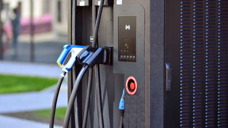 Electric car charging station. Transport plug and fuel recharge. Future energy power and green...