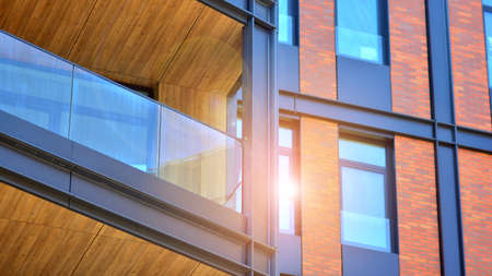Architectural exterior detail of residential apartment building with brick facade. Modern brick and...