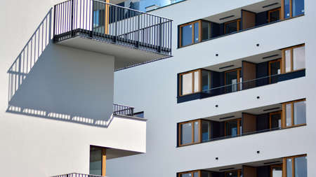 Condominium and apartment building with symmetrical modern architecture in the city downtown.