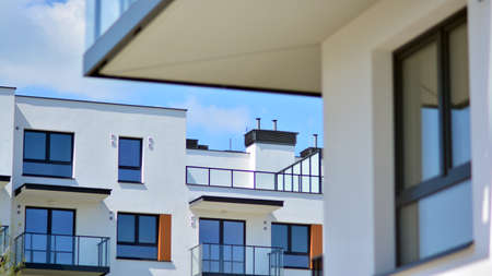 Condominium and apartment building with symmetrical modern architecture in the city downtown.