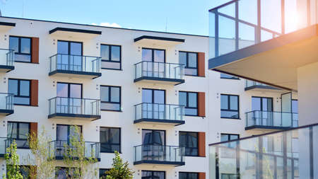 Condominium and apartment building with symmetrical modern architecture in the city downtown.