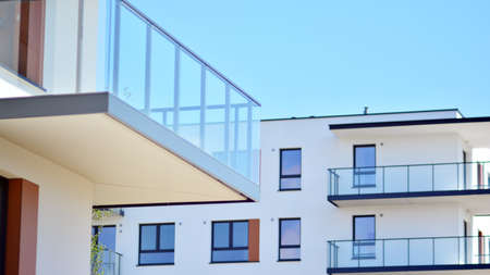 Condominium and apartment building with symmetrical modern architecture in the city downtown.