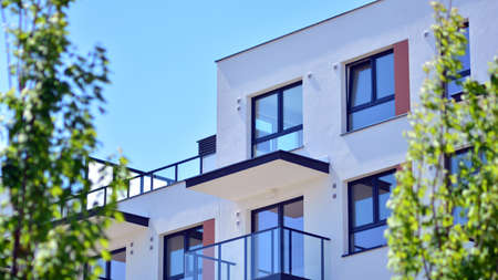 Condominium and apartment building with symmetrical modern architecture in the city downtown.の写真素材