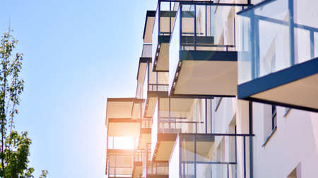 Condominium and apartment building with symmetrical modern architecture in the city downtown.