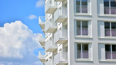 Condominium and apartment building with symmetrical modern architecture in the city downtown.の写真素材
