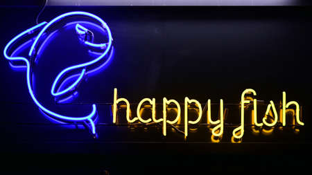 Warsaw, Poland. 30 May 2021. Neon sign Happy Fishのeditorial素材