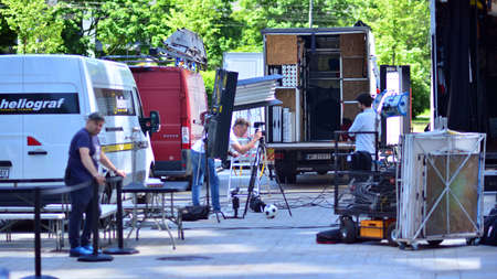 Warsaw, Poland. 14 June 2021. Busy outdoor filming production crew team. Work on an advertising...