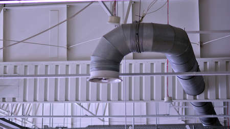 Lights and ventilation system on ceiling of the supermarket hall. Ceiling construction.