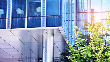 Eco architecture. Green tree and glass office building. The harmony of nature and modernity....