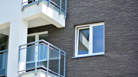 Modern apartment buildings on a sunny day with a blue sky. Facade of a modern apartment building....