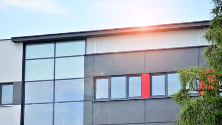 The glazed facade of an office building with reflected sky. Modern architecture buildings exterior