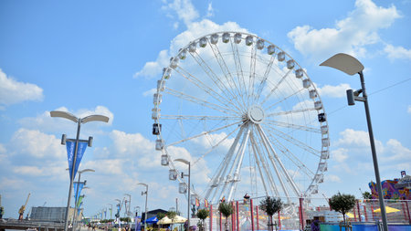 Szczecin, Poland .. 24 July 2021. View of the amusement park with a ferris wheel in the background.のeditorial素材
