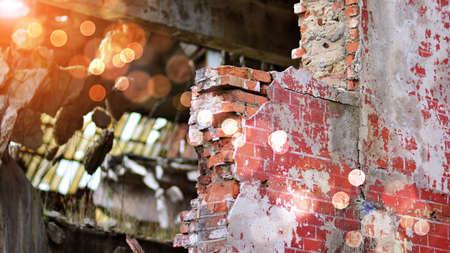 Abandoned and destroyed industrial plant factory. Red sun on horizon, bokeh solar flare.の写真素材